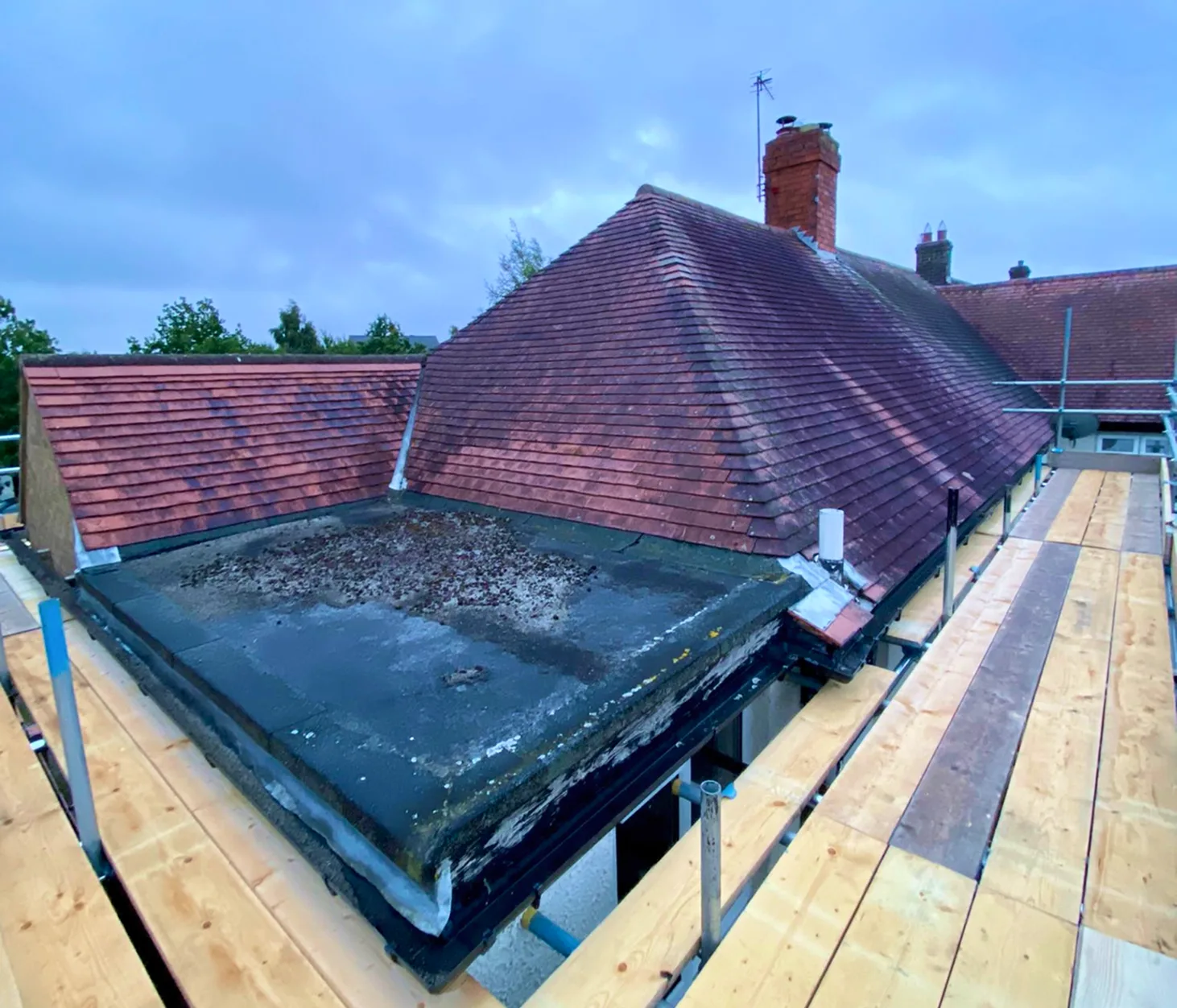 Before hip-to-gable loft conversion in Desborough